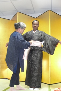 The Model Being Dressed in a Kimono