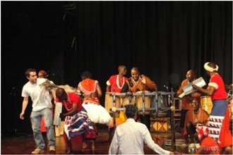 Members of the audience dancing with the ensemble of Kenyan artists