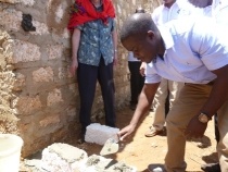 Mr. Bilal Mazoya, Kilifi County Director of Health laying the stone.