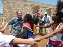 Ambassador Terada dancing together with community youth group.