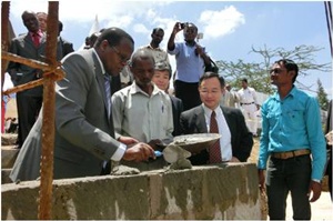 Mr. Bor laying a foundation stone