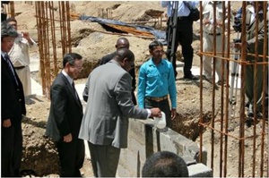 Mr. Bor laying a foundation stone