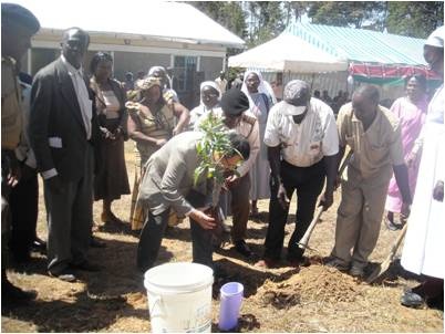 Deputy Ambassador planting a commemorative tree at the home