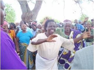 Buguta women sing and dance with the joy of expectation of water project