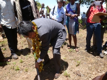 Mr. Mori planting a tree.