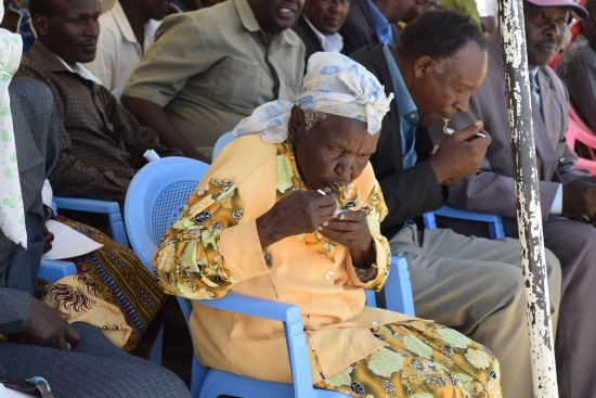 Lady from the community tasting the NISSIN noodles