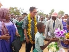 Gora Primary School welcoming H.E. Terada (Left: Mrs Juliana Lumba, the Head Teacher of Gora Primary School)