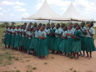 Pupils expressing joy by singing and dancing