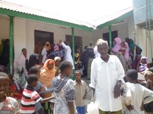 An overbrimming crowd waiting for aid of nutritional supplementary food at a Mother and Child Health Centre in Hargeysa.