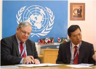 Signing (Mr. Bowden, Resident Coordinator (left) ; Ambassador Takata (right))