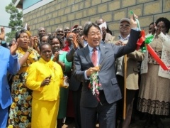 Mr.Mori cutting the ribbon to open the new school.