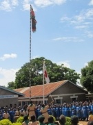 Pupils hoisting Japanese and Kenyan national flags