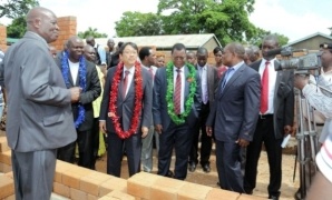Mr. Mori and officials inspecting construction site