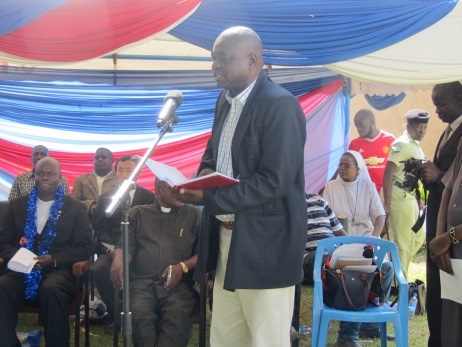 Mr. Josephat, District Education Officer giving a speech