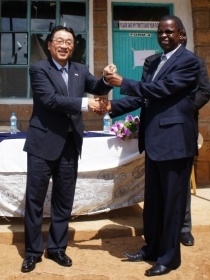 Minister Mori handing over the keys to the new boys’ dormitory to Mr. Kariuki (Chairman of St. Lucy B.O.M.)