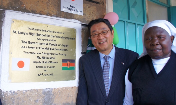 Minister Mori and Sister Olang’ unveiling plaque to commemorate the occasion