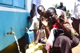 Women from the community express their joy to have the clean water in their village