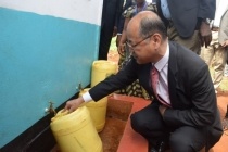 Mr. Katayama, fills the water container