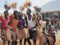 Male pupils  expressing their joy by dancing