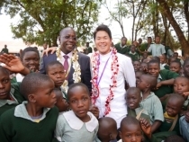 Mr. Mbito and Mr. Tanaka celebrating with pupils of Matisi Primary School